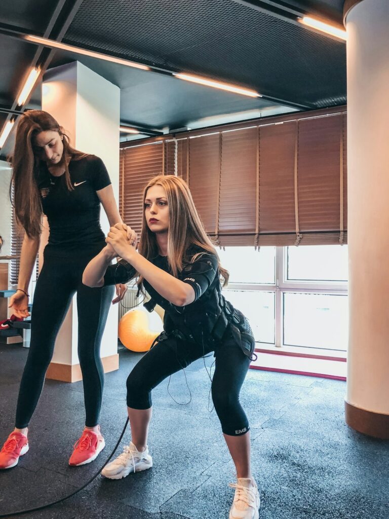 Beginner exercising at home with a chair, yoga mat, and simple bodyweight movements