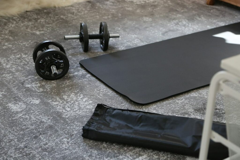 Person performing bodyweight squats and push-ups in a bright living room with an open exercise area.