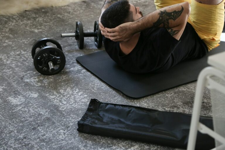 Person performing a short bodyweight workout in a bright home space with a chair and exercise mat.